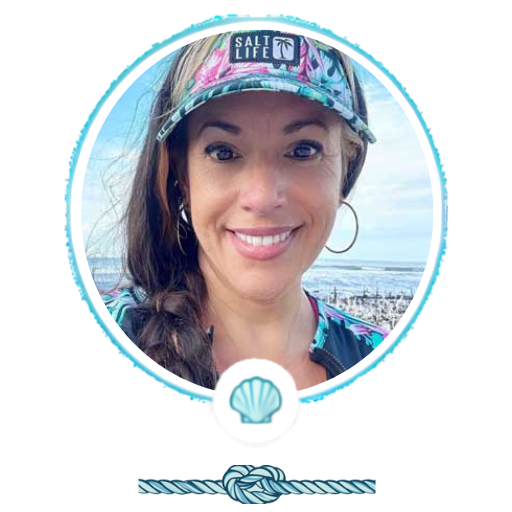 Woman smiling at the beach wearing a floral hat, framed by a shell and knot design.