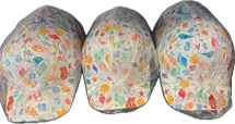 Three colorful patterned caps wrapped in plastic.