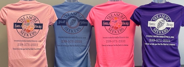 Four colorful T-shirts with 'Treasure Seeker Shell Tours' logo and contact info on the back.