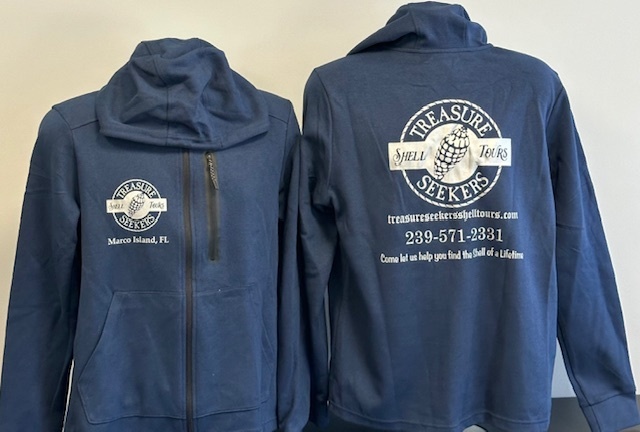 Two navy jackets with 'Treasure Seekers Shell Tours' logos and text on front and back.