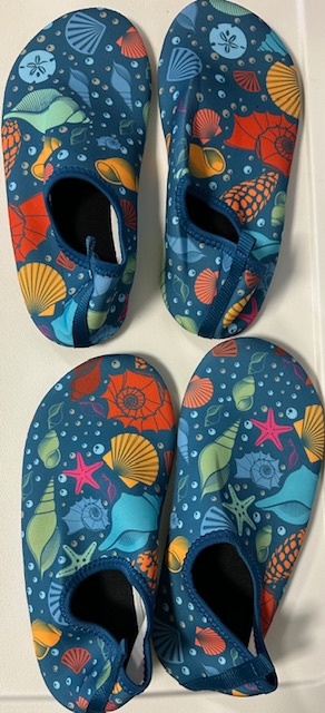 Colorful aquatic-themed shoes with shells and starfish pattern.