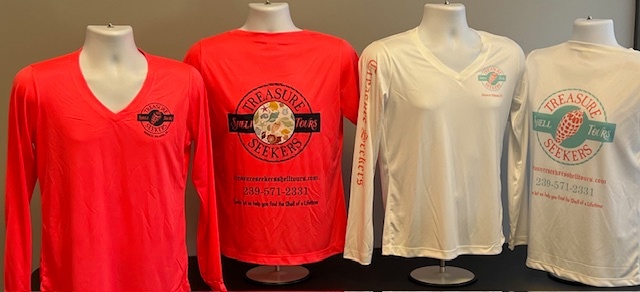 Four mannequins with red and white long-sleeve shirts displaying logos and text.